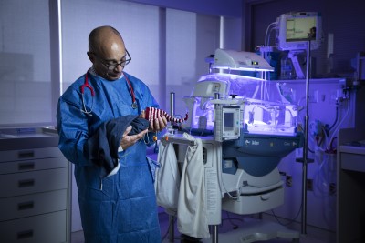 Dr. Bernard Thebaud holds a premature baby